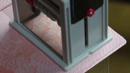 Applying UK Entry Stamp to a Passport Page