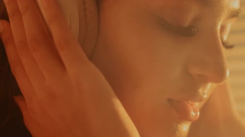 Close Up of Woman Listening with Headphones