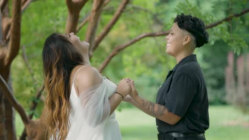 Lovely Couple Holding Hands in the Park