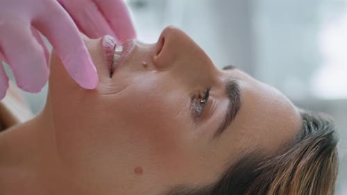 Woman Receives Facial Massage at Home Spa