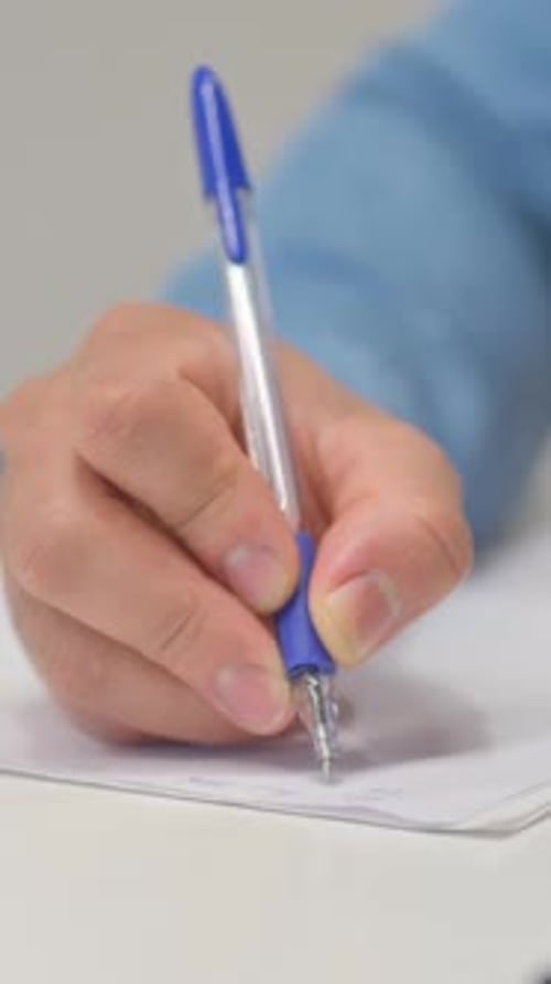 Close up of Man Writing a Letter, vertical video