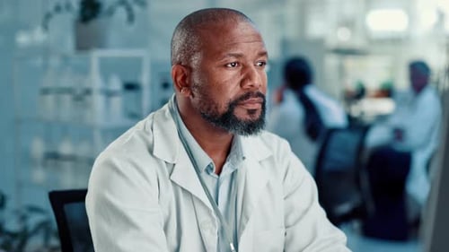 Man in Lab Coat Working in a Lab