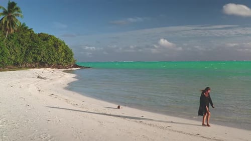 Young Woman Walking on the White Sand Beach of a Tropical Island Paradise