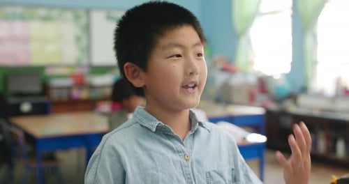 Young Student Speaking in Classroom Setting