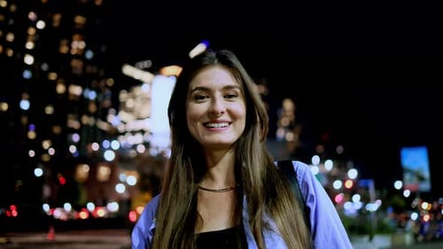 Portrait of Attractive Gorgeous Caucasian Young Woman Looking at Camera Smiling Standing on Street