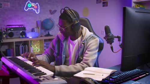 Black Man Artist Recording Music While Playing Electronic Piano at Home Studio Video