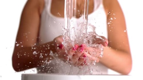 Water Pouring Into Woman'S Hands