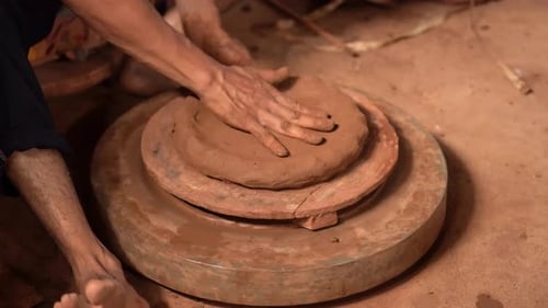 Hands Shaping Clay on Pottery Wheel