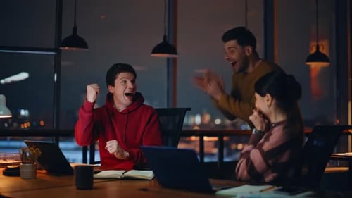 Overjoyed Staff Enjoy Achievement Giving Five at Night Coworking Office Closeup