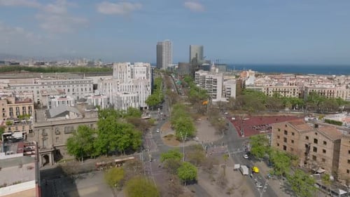Forwards Fly Over Placa Pau Vila Square Park and Crossroad in Urban Borough Pedestrians Crossing