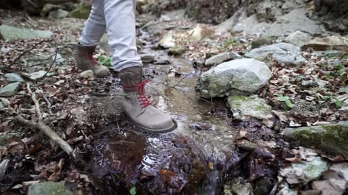 A man walks through a river