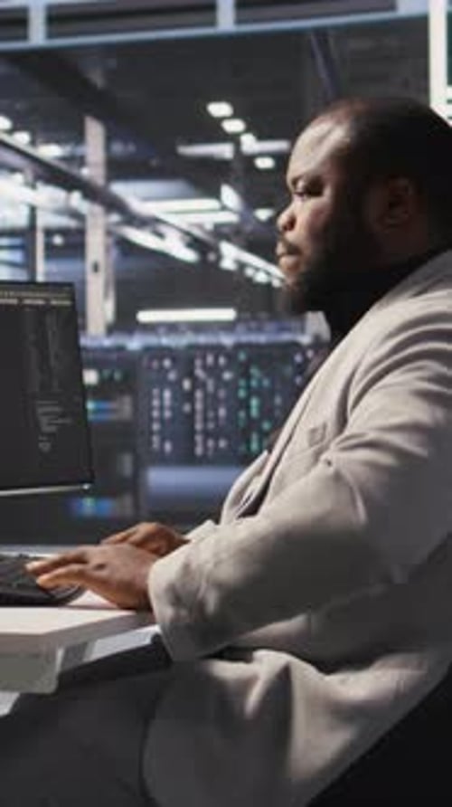 Vertical Video Exhausted Server Farm Employee Stretching Back