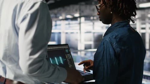 Server Farm Manager Overseeing Work Done By Engineer Reviewing LLM Visualization