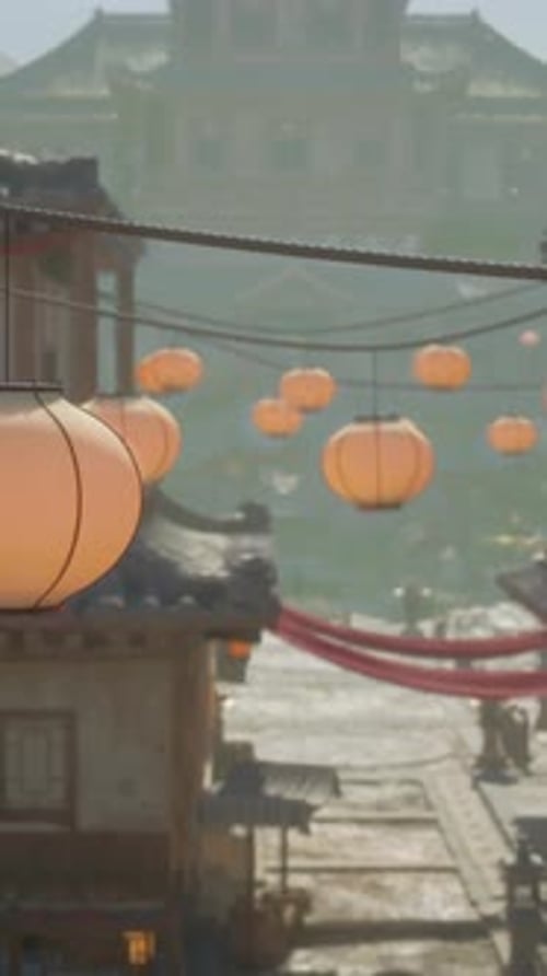 Lanterns Hanging From a Line Over a Street
