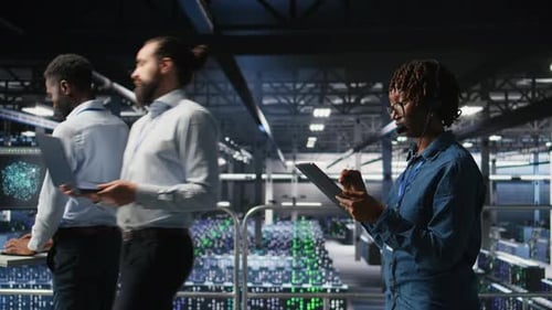 People Working Inside a Large Data Center