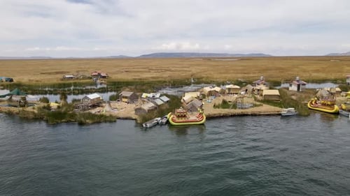 4K Aerial Drone Orbit Arc around Uros Islands at Lake Titicaca near Puno, Peru.