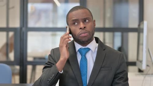 Young Adult Using Phone in Office Workplace