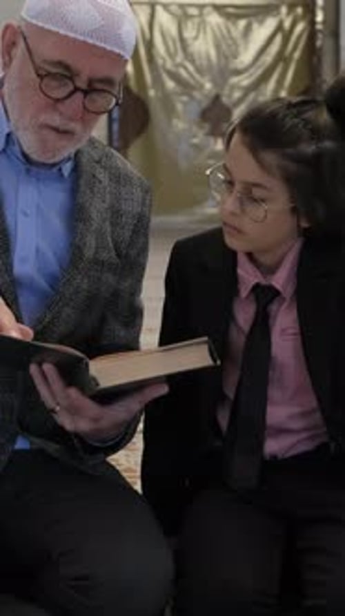 Man and Child Read Book Indoors