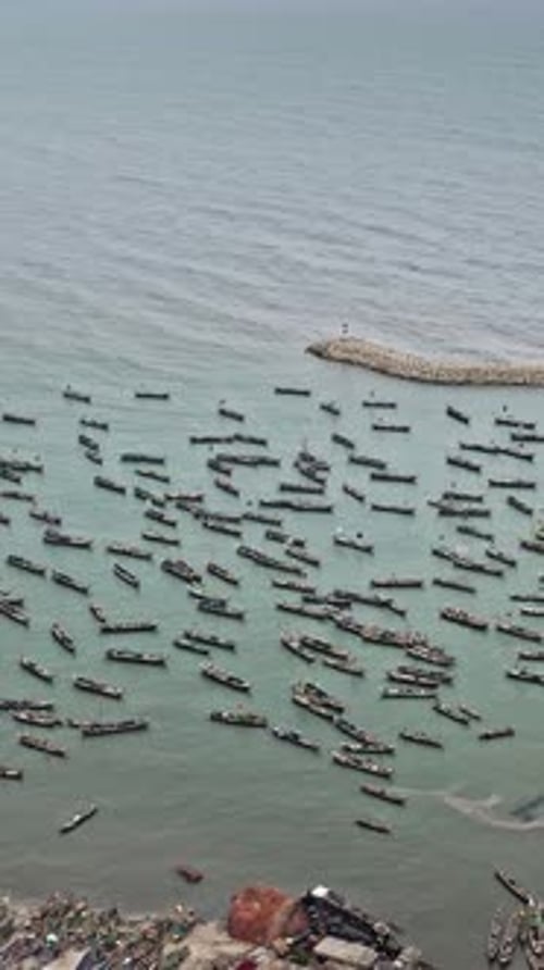 Vibrant fishing boats fill the waters near Accra, Ghana