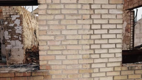 Concrete Building Remnants of Brick Damaged House