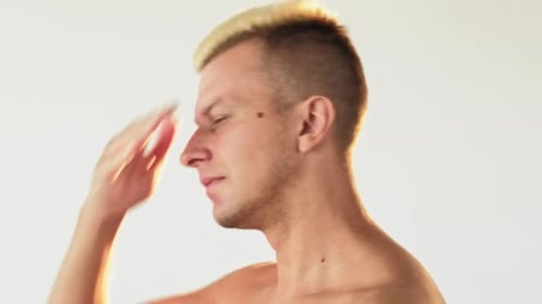 Man Drying Face with Towel Close Up