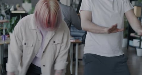 Happy Office Workers Dance Together in Celebration