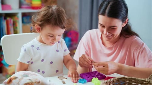 Mother and Child Play with Modeling Clay at Home