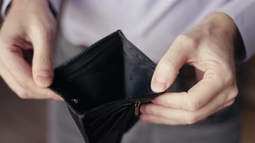 Empty Purse in the Hands of a Man Lack of Money Problems with Finances Difficulties in Life