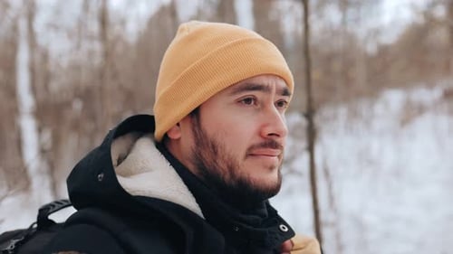 The Frozen Trail Caucasian Trekker Bearded in a Winter Wilderness