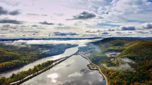 River flowing between the picturesque rocky banks covered with lush greenery.