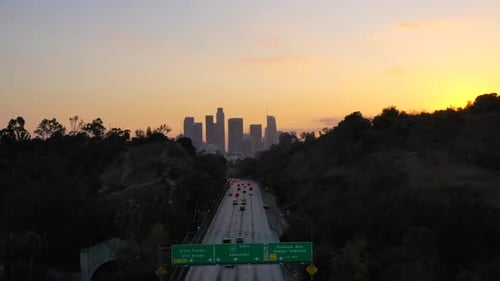 Busy Traffic On California Highway And High-rise Buildings Can Be Seen Near Indian Well Stadium,