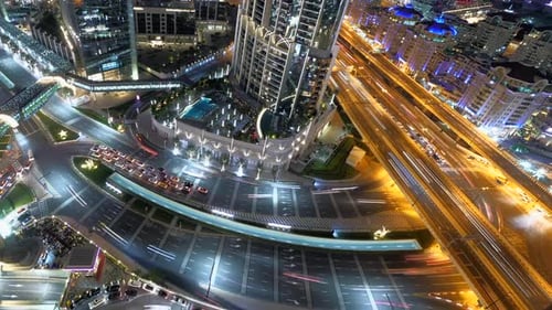 Enjoy the City Night View of Skyscraper and Highways with Beautiful Light Trails