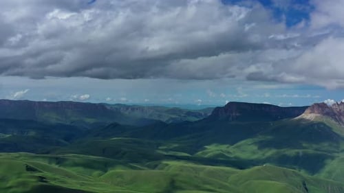 Aerial View of Green Mountains and Rolling Hills