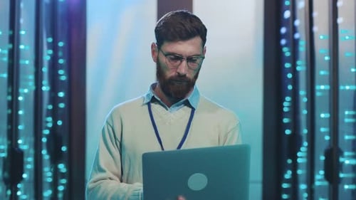 A Pro in Data Center Operations Equipped with a Laptop for Efficiency and Productivity