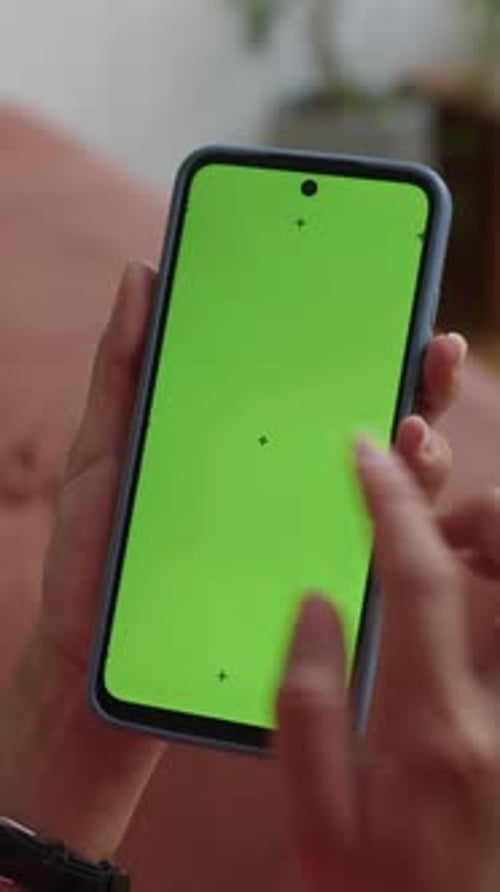 Hand Holding Phone With Green Screen Close Up