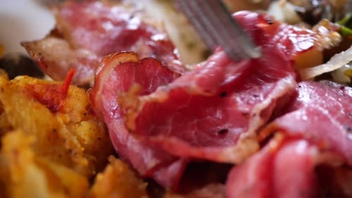 Close Up of Delicious Meal with Bacon and Potatoes