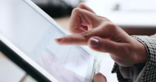 Finger Interacting with a Touchscreen Tablet in Office