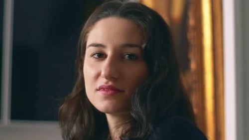 Young Woman Smiling in Close Up Portrait
