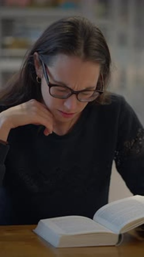 Woman Reading a Book, Takes Off Glasses