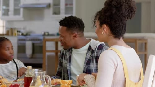 Family Enjoys Breakfast Together at Home