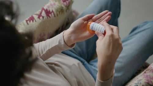 Person Taking Pill Capsule for Health and Wellness