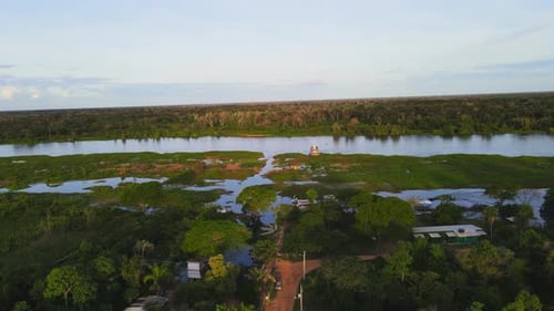 Remote Riverside Settlement in the Pantanal Brazil Aerial View at Sunset