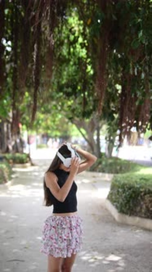 Young Woman Wearing VR Headset in Park