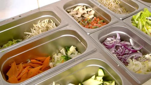 Assortment of Fresh Vegetables in Stainless Steel Containers