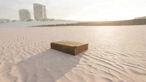 Old Book on the Sand Beach