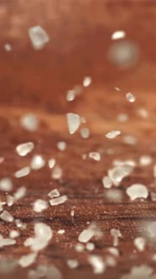 Salt Falls on a Wooden Table Filmed on a Highspeed Camera at 1000 Fps