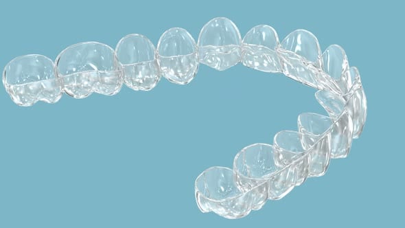 Invisalign braces or invisible retainer installation on teeth. Dental ...