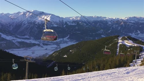 Empty Ski Resort with Cable Cars in Snowy Mountains in Winter Austrian Alps