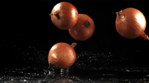 Onion Falls on the Table Filmed is Slow Motion 1000 Fps