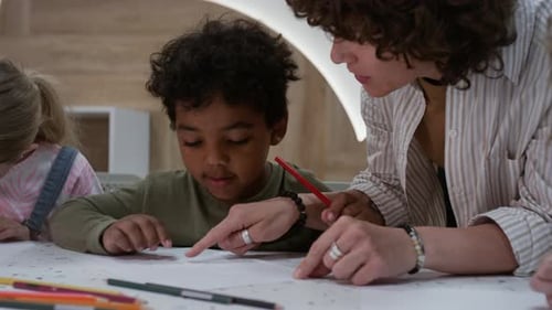 Children Learning with Teacher in Classroom
